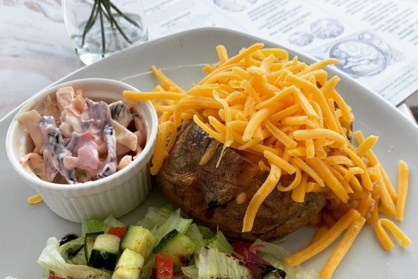 Jacket Potato with cheese and salad served at Lewis's Cafe of Morecambe